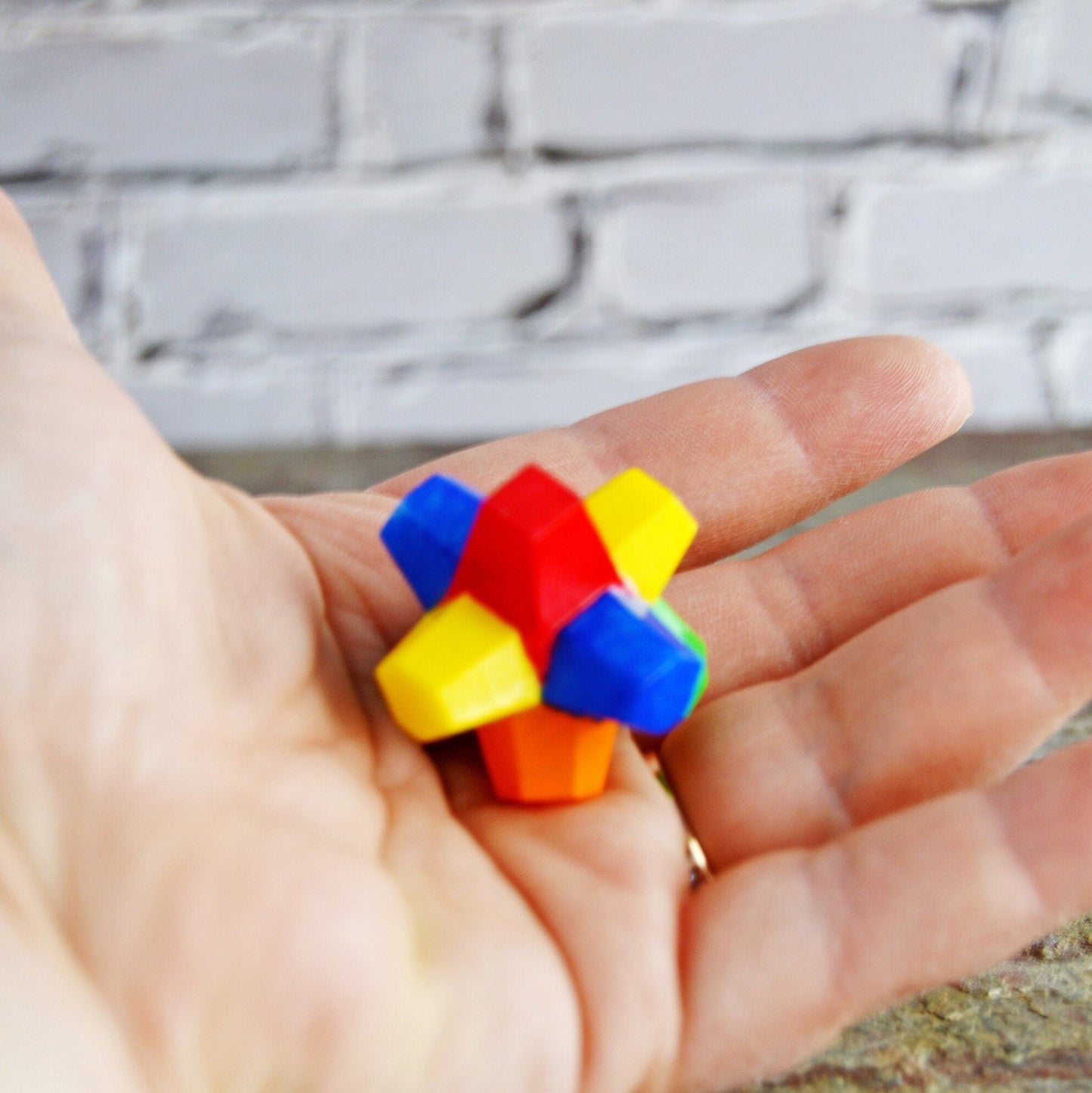 Here the gobstopper is shown being held in a woman&#39;s hand.